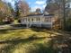 Charming ranch home with white brick exterior, covered porch, and landscaped yard at 2320 Capehart Ne Cir, Atlanta, GA 30345