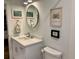 Clean bathroom with white vanity, large mirror and stylish decor at 99 Peachtree Memorial Nw Dr # D3, Atlanta, GA 30309