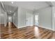 Long hallway with hardwood floors and doors to other rooms at 1510 Olympian Sw Way, Atlanta, GA 30310