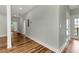 Bright hallway with hardwood floors and neutral-toned walls at 1510 Olympian Sw Way, Atlanta, GA 30310