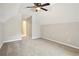 Spacious bedroom with ceiling fan and neutral wall colors at 2311 Carrington Dr, Ellenwood, GA 30294