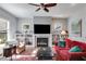 Bright living room features a fireplace, built-in shelving, and comfortable seating at 1727 Cecile Se Ave, Atlanta, GA 30316