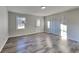 Spacious bedroom with wood-look floors and access to a private bathroom at 2067 Marbut Ln, Lithonia, GA 30058