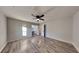 Large bedroom featuring a ceiling fan and ensuite bathroom access at 2067 Marbut Ln, Lithonia, GA 30058