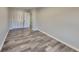 Simple bedroom with wood-look floors and closet at 2067 Marbut Ln, Lithonia, GA 30058