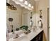 Elegant bathroom with a double vanity and large mirror at 1920 Riverpark Ln, Dacula, GA 30019