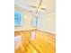 Bright bedroom with hardwood floors and ceiling fan at 225 Bayswater Dr, Suwanee, GA 30024