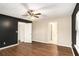 Bright bedroom with ceiling fan and wood-look floors at 24 Chantilly Pl, Mcdonough, GA 30253