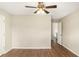 Bright bedroom with wood-look floors and access to hallway at 24 Chantilly Pl, Mcdonough, GA 30253