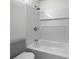 Clean bathroom with a shower/tub combo and modern tile at 492 Camelot Pkwy, Jonesboro, GA 30236