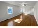 Bright bedroom featuring hardwood floors and ample closet space at 492 Camelot Pkwy, Jonesboro, GA 30236