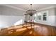 Sunlit dining room boasts hardwood floors and a stunning chandelier at 1344 N Decatur Ne Rd, Atlanta, GA 30306