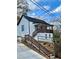 Charming white house with brown accents and a porch, steps leading to the entrance at 120 Park Se Ave, Atlanta, GA 30315