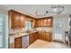 Kitchen features granite countertops, wood cabinets, and stainless steel appliances at 2531 Leeshire Rd, Tucker, GA 30084