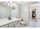 Clean bathroom with white vanity and tiled floor at 1276 Oleander Sw Dr, Lilburn, GA 30047