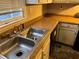 Small kitchen with double sink and laminate countertops at 193 Timber Creek Sw Ln, Marietta, GA 30060