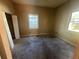 Bedroom with carpet, two windows, and a closet with double doors at 1480 Belmont Sw Ave, Atlanta, GA 30310