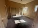 Bright bedroom with carpet, two windows, and double door closets at 1480 Belmont Sw Ave, Atlanta, GA 30310
