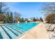 Inviting outdoor pool with lounge chairs and a spacious deck at 3300 Windy Ridge Se Pkwy # 1113, Atlanta, GA 30339