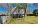 Home's backyard with wooden fence and green grass at 2193 Hampton Se Trl, Conyers, GA 30013