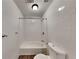 Simple bathroom with white tiled walls and a shower/tub combo at 2193 Hampton Se Trl, Conyers, GA 30013