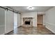 Gathering room with stone fireplace and barn-style sliding doors at 2193 Hampton Se Trl, Conyers, GA 30013