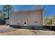 Rear exterior view of the house with gray siding at 2193 Hampton Se Trl, Conyers, GA 30013