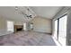 Spacious living room with a stone fireplace and carpeting at 2193 Hampton Se Trl, Conyers, GA 30013