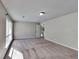 Large main bedroom with wall-to-wall carpet and large window at 2193 Hampton Se Trl, Conyers, GA 30013