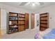 Bright bedroom with ample closet space and built-in shelving at 2616 Landington Nw Way, Duluth, GA 30096