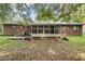 Brick house back view, showing a screened porch and patio at 2616 Landington Nw Way, Duluth, GA 30096