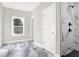 Modern bathroom with marble shower and gray tile floor at 4562 Spring St, Acworth, GA 30101