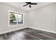 Well-lit bedroom with gray flooring and a large window at 4562 Spring St, Acworth, GA 30101