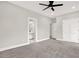 Large bedroom with gray carpeting, ceiling fan, and en-suite bathroom at 4562 Spring St, Acworth, GA 30101
