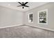 Bright bedroom with gray carpeting and two large windows at 4562 Spring St, Acworth, GA 30101