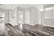 Open dining area with white cabinets, gray flooring, and pendant lighting at 4562 Spring St, Acworth, GA 30101