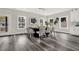 Modern dining room with large table, six chairs, and hardwood floors at 4562 Spring St, Acworth, GA 30101