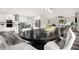 Open concept dining room with large table and access to kitchen at 4562 Spring St, Acworth, GA 30101