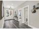 Spacious entry hall featuring gray flooring and stylish decor at 4562 Spring St, Acworth, GA 30101