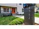 Modern house number marker in front of a two-story home with orange front door at 4562 Spring St, Acworth, GA 30101