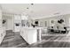 Open concept kitchen and dining area with large island and hardwood floors at 4562 Spring St, Acworth, GA 30101
