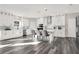 Bright kitchen with white cabinets, quartz countertops, and gray flooring at 4562 Spring St, Acworth, GA 30101