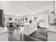 Modern white kitchen with a large island and stainless steel appliances at 4562 Spring St, Acworth, GA 30101