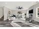 Spacious living room with hardwood floors, fireplace, and ceiling fan at 4562 Spring St, Acworth, GA 30101