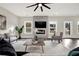 Living room with hardwood floors, fireplace, and large windows at 4562 Spring St, Acworth, GA 30101
