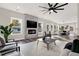 Open living room with fireplace, hardwood floors, and a view into the dining area at 4562 Spring St, Acworth, GA 30101