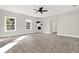 Large main bedroom with fireplace, carpet, and ceiling fan at 4562 Spring St, Acworth, GA 30101