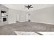 Main bedroom with carpet, fireplace, and ceiling fan at 4562 Spring St, Acworth, GA 30101