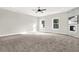 Spacious main bedroom with carpeted floor and ceiling fan at 4562 Spring St, Acworth, GA 30101