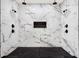 Large walk-in shower with marble tile and dual shower heads at 4562 Spring St, Acworth, GA 30101